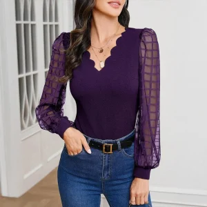 Blus med transparenta rutiga ärmar